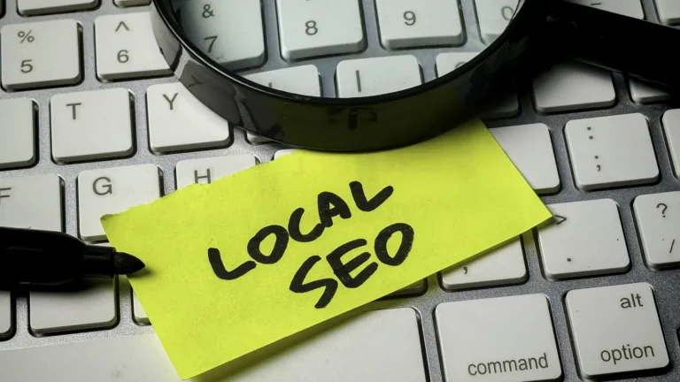 Local SEO for dispensaries: a sticky note that reads Local SEO on a keyboard, under a magnifying glass